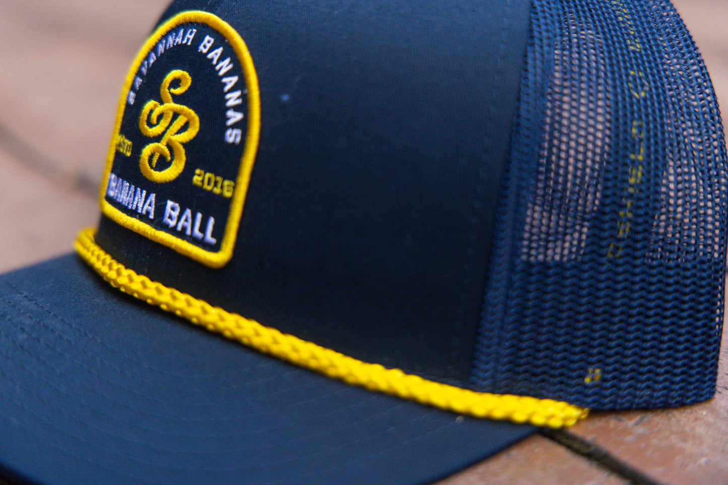 Bananas Evoshield Trucker Patch Logo Hat with Yellow Rope- Navy